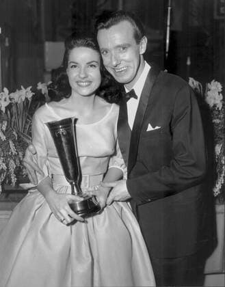 Bryan Johnson and the French singer Jacqueline Boyer , here 18 years old , with the trophy which she received after winning the Eurovision Song Contest held at the Royal Festival Hall , London on 29th March 1960 with the song Tom Pillibi UnitedArchives00156931 