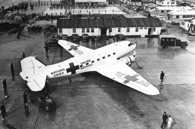 Charted by the United Nations this plane was used by UN mediator for Palestine, Count Folke Bernadotte and his staff in their travels to the countries of the Middle East. The aircraft is a DC-3 Douglas Transport and is painted white with Red Cross insignia and the words United Nations in English and French. 1948, Vereinte Nationen, UN UnitedArchives00283173 
