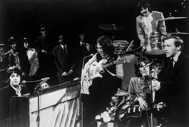 The Beatles performing on the David Frost TV show with David Frost on the far right . 10th September 1968 UnitedArchives00419783 