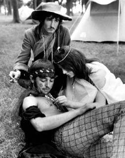 A girl paints a flower on a boy s chest during the Love-In Festival at Woburn. 26th August 1967 UnitedArchives00589924 