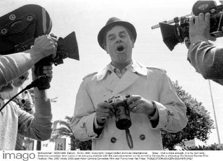 Okay...that s close enough, it s my turn now . American comedian Jerry Lewis in an amusing position with the cine cameramen on his arrival in Cannes.He is attending the famous Cannes Film Festival. May 1967 UnitedArchives00927575 