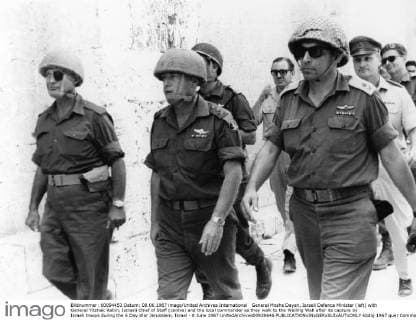General Moshe Dayan, Israeli Defence Minister (left) with General Yitzhak Rabin, Istraeli Chief of Staff (centre) and the local commander as they walk to the Wailing Wall after its capture by Israeli troops during the 6 Day War Jerusalem, Israel - 8 June 1967 UnitedArchives00928646 