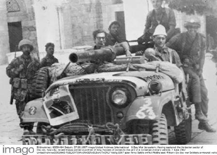 6 Day War Jerusalem: Having captured the Jordanian sector of this old, holy city, Israeli troops pinned a portrait of King Hussein of Jordan to the grill of a Jordanian military vehicle. 7 June 1967 UnitedArchives00928660 