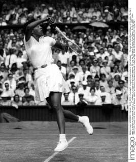 29 year old Miss Althea Gibson of America. the No 1 seed in action on the centre court at Wimbledon in the semi-final match against 16 year old Christine Truman from Essex. 4th July 1957 UnitedArchives00929492 