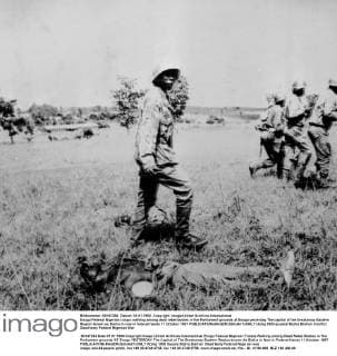 Enugu Federal Nigerian troops walking among dead rebel bodies in the Parliament grounds at Enugu yesterday The capital of the breakaway Eastern Region known as Biafra in now in federal hands 11 October 1967  UnitedArchives00941288