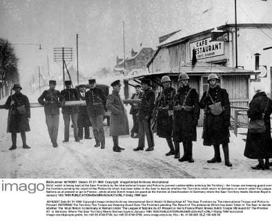 Strict watch is being kept at the Saar Frontiers by the International troops and Police to prevent undesirables entering the Territory - the troops are keeping guard over the frontiers pending the result of the Plebiscite which has been taken in the Saar to decide whether the Terrritory shall return to Germany or remain under the League of Nations as at present or go to France - photo shows Dutch troops on guard at the frontier at Zweilbrueken in Germany where the Saar Territory meets German Bayeris January 14th 1935  UnitedArchives00952383