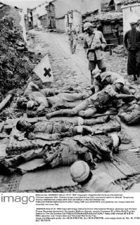 Chinese-Japanese War: Chinese troops wounded during their successful battle to liberate Tengchung receive treatment at a make-shift first aid station in the old Chinese city.  UnitedArchives01008707