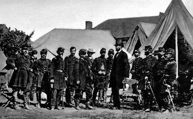 Abraham Lincoln as the subject of an early war photograph: a picture taken in 1862 during the American Civil War showing the President discussing the progress of the campaign with his staff Â  UnitedArchives01015484
