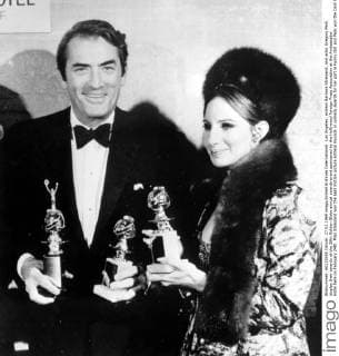 Los Angeles: actress Barbara Streisand, and actor Gregory Peck display their awards at the 26th Golden Globe annual awards event sponsored by the Hollywood Foreign Press Association at the Ambassador Hotel here on February 24th. Miss Streisand won the best motion picture actress musical or comedy awards for her part in Funny Girl and Peck won the Cecil B. De Mille Award and accepted the best motion picture actor musical or, comedy awards for Ron Mood s part in Oliver. 27th February, 1969  UnitedArchives01029916