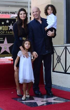Actor Vin Diesel poses with his longtime girlfriend, Mexican model Paloma Jimenez and their daughter Similche (L) and son Vincent during an unveiling ceremony honoring him with the 2,504th star on the Hollywood Walk of Fame in Los Angeles on August 26, 2013.  LAP20130822639