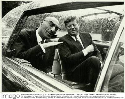 9 May 1963 John F. Kennedy , President of the USA with King Mohammed Zahir of Afghanistan. Pictured in the back seat of a limousine in a motorcade that took the visiting monarch through heavy rain to the President s Guest House following a welcome at the White House. Washington DC, USA.  UnitedArchives00871361