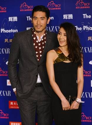Actor Godfrey Kao (L) and actress Gao Yuanyuan attend the 2013 BAZAAR Stars Charity Night in Beijing, capital of China, Oct. 10, 2013. Over 400 showbiz stars, entrepreneurs and celebrities attended the event, which raised more than 62 million yuan (10.1 million US dollars) in Beijing on Thursday. (Xinhua Wang Quanchao) (wr) CHINA-BEIJING-2013 BAZAAR STARS CHARITY NIGHT (CN) 