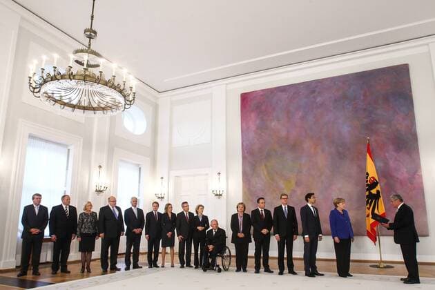 (131022) -- BERLIN, Oct. 22, 2013 (Xinhua) -- German Chancellor Angela Merkel (2nd R) receives dismissal documents from German President Joachim Gauck (1st R) during the resignation ceremony at the Bellevue Presidential palace, Berlin, Germany, on Oct. 22, 2013. German Chancellor Angela Merkel and her cabinet were officially resigned Tuesday. (Xinhua Zhang Fan) GERMANY-BERLIN-CABINET-RESIGNMENT 