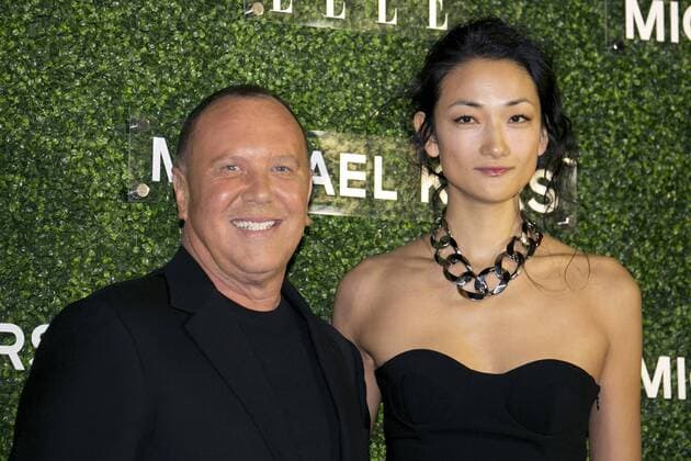 (L to R) The fashion designer Michael Kors and the model Ai Tominaga pose for the cameras at the event Michael Kors in Japan in the Tokyo National Museum, November 13, 2013. She wears the dress of Fall 2013 Collection designed by Michael Kors. The event is held to commemorate that Miranda Kerr with Michael Kors dress will be on the cover of the magazine ELLE Japon .  (vvna_michaelkorsinjapan4828)