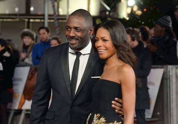 English actor Idris Elba and English actress Naomie Harris attend the Royal film performance of Mandela: Long Walk to Freedom at The Odeon Leicester Square in London on December 5 2013.  LON20131205240