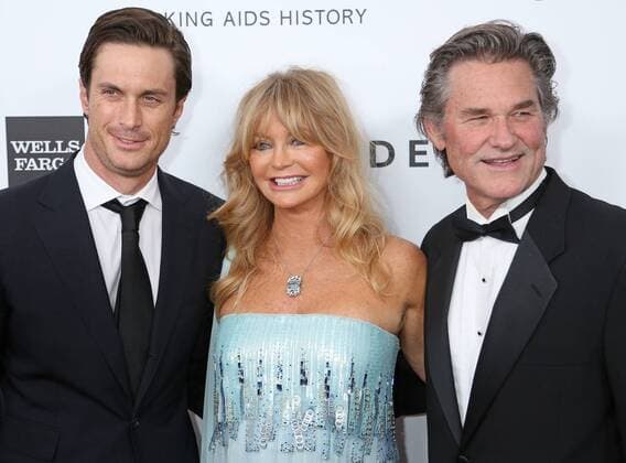 Oliver Hudson (L), Goldie Hawn (C) and Kurt Russell arrive on the red carpet during the 2013 amfAR Inspiration Gala at Milk Studios in Los Angeles on December 12, 2013.  LAP20131212830