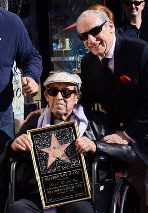 Actor and director Paul Mazursky holds a replica plaque as he poses with director Mel Brooks during a ceremony honoring him with the 2,515th star on the Hollywood Walk of Fame in Los Angeles on December 13, 2013.  LAP2013121302