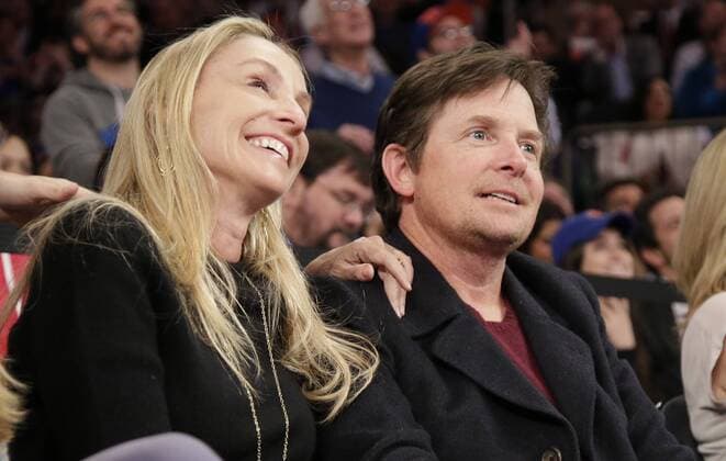 Michael J. Fox, 60. Geburtstag am 9. Juni Michael J. Fox and Tracy Pollan watch the Miami Heat play the New York Knicks at Madison Square Garden in New York City on January 9, 2014. The Knicks defeated the Heat 102-92.  NYP20140109181
