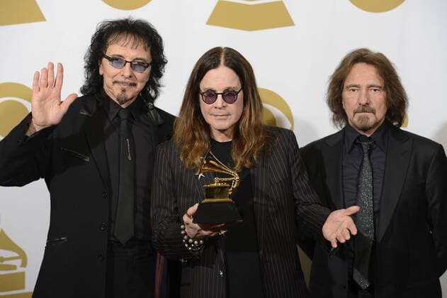 (L-R) Recording artists Tony Iommi, Ozzy Osbourne and Geezer Butler of Black Sabbath hold their Grammy Award for Best Metal Performance for the song God is Dead? at the 56th annual Grammy Awards at Staples Center in Los Angeles on January 26, 2014.  LAP20140126221