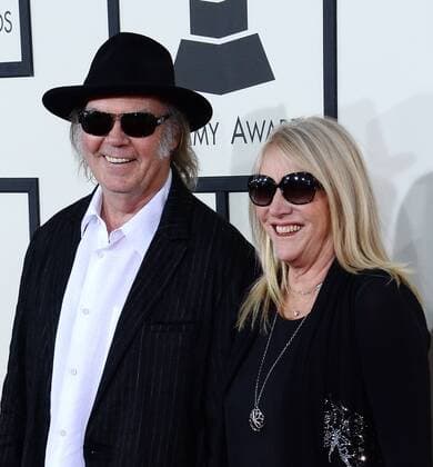 Recording artists Neil Young (L) and Pegi Young arrive for the 56th annual Grammy Awards at Staples Center in Los Angeles on January 26, 2014.  LAP20140126554