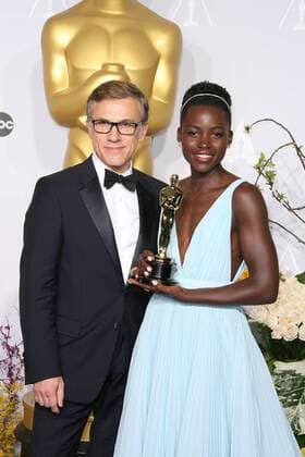 Lupita Nyong o, Christoph Waltz 86TH ANNUAL ACADEMY AWARDS - PRESS ROOM Hollywood  Brendan Miller PicturePerfect