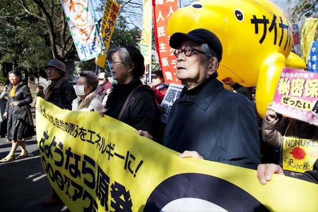 Tokyo, Japan - (R to L) The Nobel Prize winner in Literature, a Japanese author, Kenzaburo Oe leads the Sayonara Genpatsu rally at the central Tokyo on March 15, 2014. The rally was organized by the Sayonara Genpatsu 10 Million People s Action after the third anniversary of the Fukushima Daiichi Nuclear disaster 3rd anniversary.  (vvna_sayonaragenpatsu5847)
