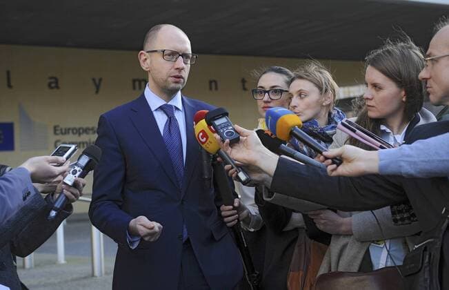 Prime Minister of Ukraine Arseniy Yatseniuk answers reporters questions during his stay in Brussels, Belgium, March 21, 2014. Ukrinform. 