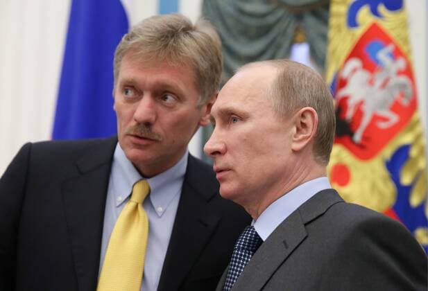 ITAR-TASS: MOSCOW, RUSSIA. MARCH 25, 2014. Russia s president Vladimir Putin (R) and spokesman Dmitry Peskov at a ceremony for the year 2013 to present national awards to literary and art professionals intending their work for children and youth.  RE13DDD4