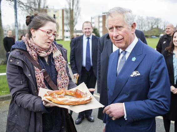 Prince Charles is given a large Pretzel by German baker Petra Braun, who commented you may as well have this as you are German , to which Prince Charles responded A long time ago! , as he visits the Ham Close Estate near Richmond on behalf of the Prince s Foundation for Building Community. Ham Close, Richmond, United Kingdom. Wednesday, 26th March 2014. Picture by i-Images i-Images  IIM-1898-0003