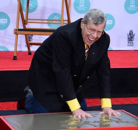 Actor Jerry Lewis participates in a hand & footprint ceremony, placing his hands and feet in wet cement in the forecourt of the TCL Chinese Theatre (formerly Grauman s), in the Hollywood section of Los Angeles on April 12, 2014.  LAP2014041211