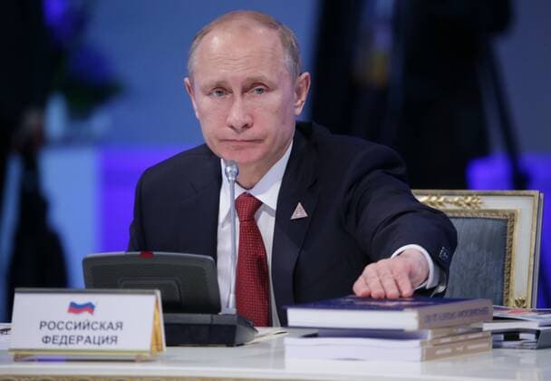 ITAR-TASS: ASTANA, KAZAKHSTAN. MAY 29, 2014. President Vladimir Putin of Russia looks on during a session of the Supreme Eurasian Economic Council, at the Palace of Independence.  premiumd Highlight RE145728