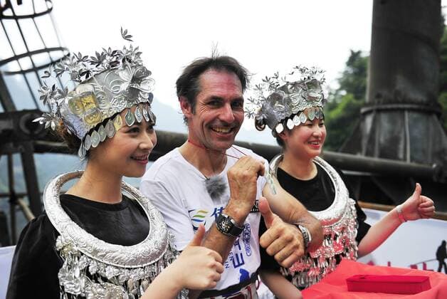 ZHANGJIAJIE, CHINA - JUNE 28: (CHINA OUT) Freddy Nock, known as Europe s King of the High Wire , performs a ritual for luck before walking on the Tianmen Mountain Cableway without any protective measures on June 28, 2014 in Zhangjiajie, Hunan Province of China. Freddy Nock, who is a world record holder of various events and known as Europe s King of the High Wire , once again took on the challenge of walking on Asia s longest and most dangerous cable, the Tianmen Mountain Cableway, without any protective measures. After walking 420 m, he gave up because the slope was too steep and his feet were too slippery. In 2010, Nock did the same challenge at Tianmen Mountain Cableway. He walked for about 200 m before giving up due to severe rolling and shaking of the cable beneath his feet.  CFPpremiumd 0462