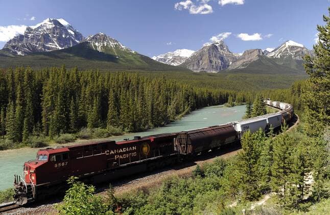 Banff, Alberta; Canada---CPR (Canadian Pacific Railway) freight train travelling between Lake Louise and Banff within Banff National Park, Alberta. digital photo by Larry MacDougal