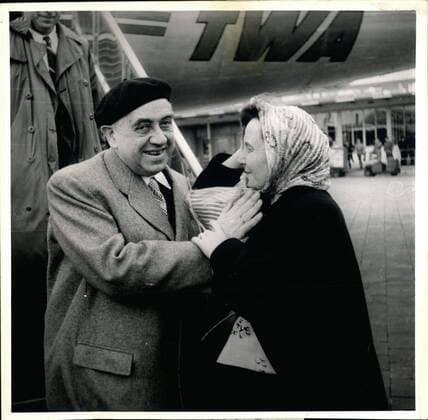 Mar. 30, 1953 - German politician Prof. Ernst Reuter arrived back in Germany after a visit to the USA. He is greeted by his wife at the airport.  - ZUMAk09