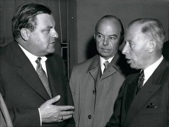 Jun. 06, 1957 - The Iller-accident at the parliament: When the German parliament met on Wednesday for its last meeting-period. The state secretary in defense FRANZ JOSEF STRAUSS gave a report to the death of the 15 recruits of the Iller-river accident and the blind-shell-accident on the training field Grafenwohr. Photo shows: Secretary STRAUSS after his official explanation leaving the parliament together with GENERAL HEUSINGER (right) and the chief of the army General-lieutenant ROETTIGER.  - ZUMAk09