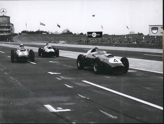Aug. 08, 1959 - Great Prize of Germany on the Avus: Yesterday (Aug 2nd, 1959) there was the international rac~~~ for racing cars of formula I on the Avus in Berlin. After a hard fight between the Ferrari-drivers among themselves, Tony Brooks (Tony Brooks) of England was first and so won the Great Prize of Germany . Second was Dan Guerney (Dan Guerney), USA, and third Phil Hill (Phil Hill), USA. o.p.s. The cars of the first three, arriving at the finishing line. Car number4 is Tony Brooks, number6 Dan Guerney and number 5 Phil Hill.  - ZUMAk09