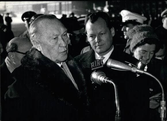 Jan. 01, 1960 - Official visit to Berlin; On. Jan. 11th, Federal Chancellor Dr. Konrad Adenauer arrived in Berlin for a 2 days visit. He will speak before the senate also about the anti Jewish out breaks during the last time. Photo Shows Dr. Konrad Adenauer (left) with the Ruling Mayor of Berlin, Will Brandt (right) at the arrival of the Chancellor on the Berlin airport.  - ZUMAk09