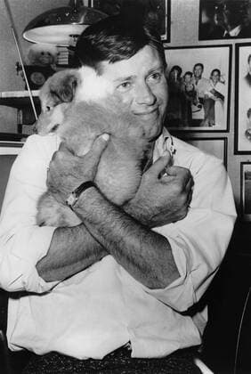 Jan. 1, 1950 - Los Angeles, CA, USA - Perhaps no popular film artist in history inspired quite so many conflicting opinions and emotions as actor and comedian JERRY LEWIS. Often reviled in his native United States but worshipped as a genius throughout much of Europe and especially France, Lewis took slapstick comedy to new realms of absurdity and outrageousness. PICTURED: Lewis cuddling with a puppy. Los Angeles United States of America  - ZUMAk09