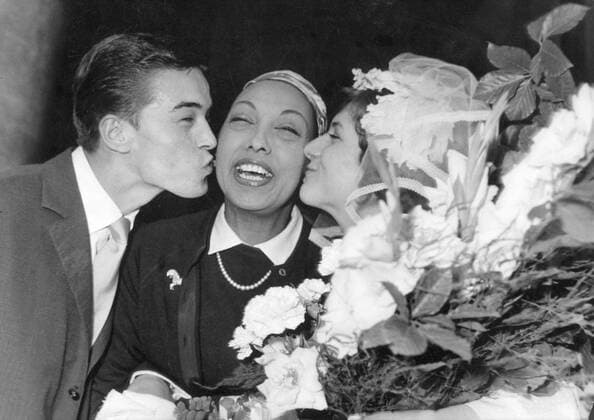 IMAGO ICONS: Josephine Baker May 27, 1959 - Paris, France - Virtually an instant hit, JOSEPHINE BAKER became one of the best-known entertainers in both France and much of Europe. Her exotic, sensual act reinforced the creative images coming out of the Harlem Renaissance in America. PICTURED: Surrounded by fans. Paris France  - ZUMAk09