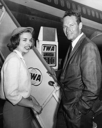 Nov. 3, 1961 - Rome, Italy - Actor CHARLTON HESTON known for his religious roles in Ben-Hur and The Ten Commandments , pictured with TWA hostess, NANCY FATENAUDE as he boards the plane to Berlin from Rome. Rome Italy  - ZUMAk09