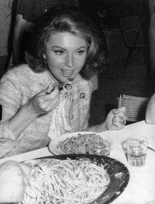 Aug. 5, 1962 - London, England, U.K. - Actress SYLVA KOSCINA (1933-1994), born as Sylva Koskinon, was a Yugoslavian-born Italian actress best remembered as Iole, the bride of Hercules in Hercules and Hercules Unchained. She died in Rome in 1994 of breast cancer. PICTURED: Sylva eating spaghetti at a dinner. London United Kingdom  - ZUMAk09