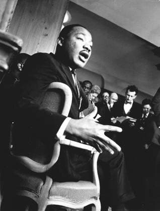 Sept. 22, 1964 - London, England, U.K. - Reverend MARTIN LUTHER KING JR. (1929-1968) was a prominent leader of the African American Civil Rights Movement. Tragically King was assassinated on April 4, 1968 on the balcony of the Lorraine Motel. PICTURED: MLK, Jr. sitting in a chair speaking in London. London UK  - ZUMAk09