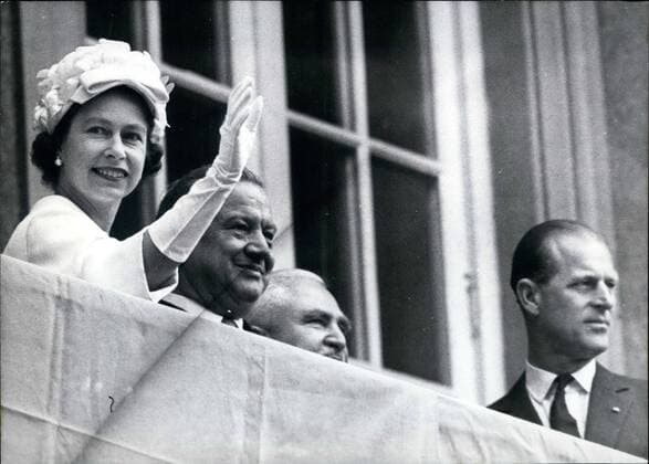 May 05, 1965 - The Queen in Munich: In the morning of the 21st May Queen Elizabeth II of Great Britain and Prince Philip arrived in Munich on their 10-day-visit to West Germany. Thousands of people, waving and shouting with joy, welcomed the Queen and the Duke of Edinburgh as they passed through the streets of Munich. Photo shows Queen Elizabeth, Minister president Goppel, Dr.Hundhammer and prince Philip on the balcony to the chancery.  - ZUMAk09