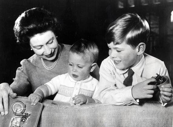 June 1, 1965 - Windsor, England, U.K. - The elder daughter of King George VI and Queen Elizabeth, ELIZABETH WINDSOR (named Elizabeth II) became Queen at the age of 25, and has reigned through more than five decades of enormous social change and development. PICTURED: QUEEN ELIZABETH II playing with her children PRINCE ANDREW and PRINCE EDWARD (right). Windsor United Kingdom  - ZUMAk09