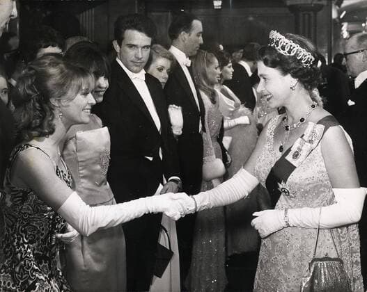 Mar 15, 1966 - London, England, United Kingdom - Britain s QUEEN ELIZABETH II is pictured shaking hands with actress JULIE CHRISTIE before she starts the Royal Film Performance Born Free . at the Odeon Theatre, Leicester Square, last night. Next to Miss Christie are LESLIE CARON, WARREN BEATTY, CATHERINE DENEUVE, CHRISTOPHER LEE, URSULA ANDRESS and RAQUEL WELCH.. London United Kingdom  - ZUMAk09