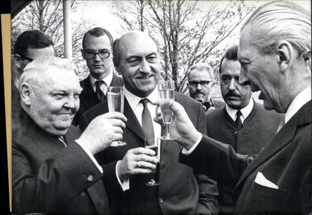 Feb. 04, 1967 - Professor Erhard turned 70 on February 4th and, against his wishes, many of his political and personal compatriots threw a party for him. Pictured from left to right front row: Prof. Dr. Erhard, architect and illustrator Ernst Maria Lang, and Chancellor Kiesinger toasting the birthday boy.  - ZUMAk09
