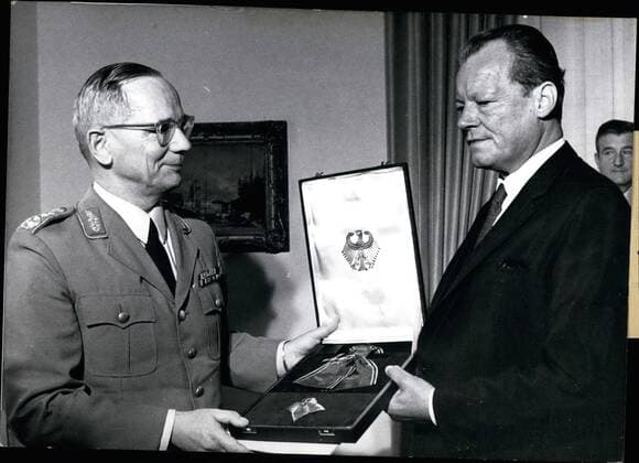 Jun. 06, 1970 - The Distinguished Service Cross.: with Ribbon and Star of the FRG was given to the first soldier of the German Army, General Inspector, Ulrich de Maiziere, Chancellor Willy. Brandt (right) who thus honoured the highest ranking German soldier stated on that occasion, that General de Maiziers (left) had created the organizational and personal basis of the modern German troops and that his honour was one to the whole German army as well.  - ZUMAk09