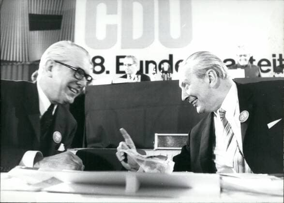 Jan. 01, 1971 - The18th party congress of the Christian Democrate Union in Dusseldorf: In the beginning of the party congress of the CDU (Christian Democratic Union) in Dusseldorf (Germany) the leaders of the CDU and the CDU (Christian Social Union), Keisinger and Strauss spoke impressively about their political cooperation which they are willing to intensify. Kiesinger said that everybody who would even only think of a separation of both parties had also to face the thought taht this would mean the end of the possibility for the CDU to become the leading party. m strau~ said that both parties should still keep together. Picture Shows: In a Friendly manner the leader of the CDU and former Federal Chancellor Dr. Kurt Georg Kiesinger gives the president of the German bundestag, Kai Uwe von Kassel (left a hint.  - ZUMAk09