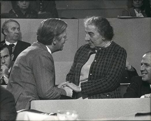 Dec. 12, 1974 - Herr Schmidt Meets Golda Meir: Herr Helmut Schmidt, the West German Chancellor, greeting Mrs. Golda Meir, Israel s former Prime Minister, at the Labour party conference in Central Hall, Westminster, on Saturday. Herr Schmidt had just finished his address as fraternal delegate.  - ZUMAk09