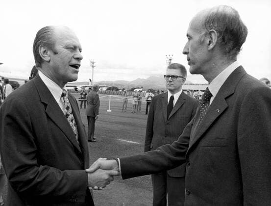 Dec. 15, 1974 - Nassau, West Indies - The President GISCARD D ESTAING met the President GERALD FORD during his official visit in the West Indies. The picture shows President VALERY GISCARD D ESTAING and President GERALD FORD shaking their hands at the Fort-De-France airport in West Indies. In the back is J.P. FOURCADE. Nassau Bahamas  - ZUMAk09